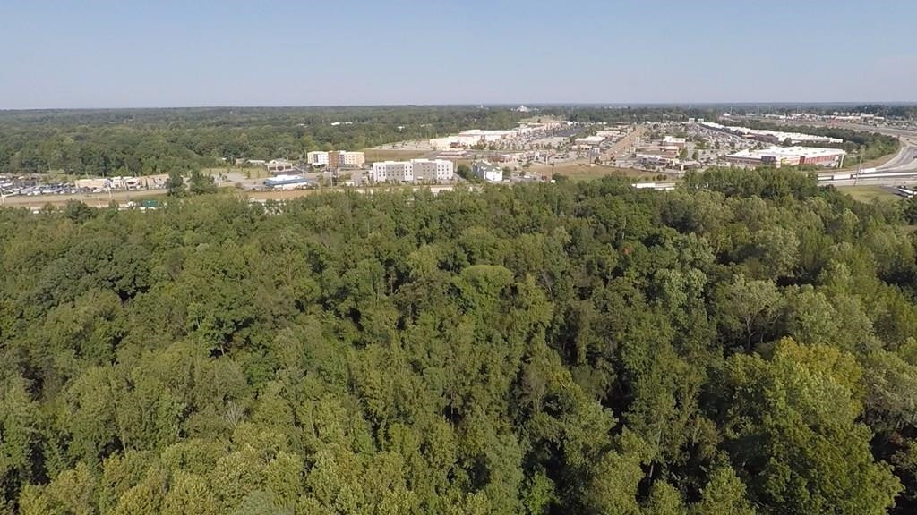 0 Interstate 40 Expressway Jackson, TN 38305 - Photo 7 of 18 an aerial view of residential houses with outdoor space and trees