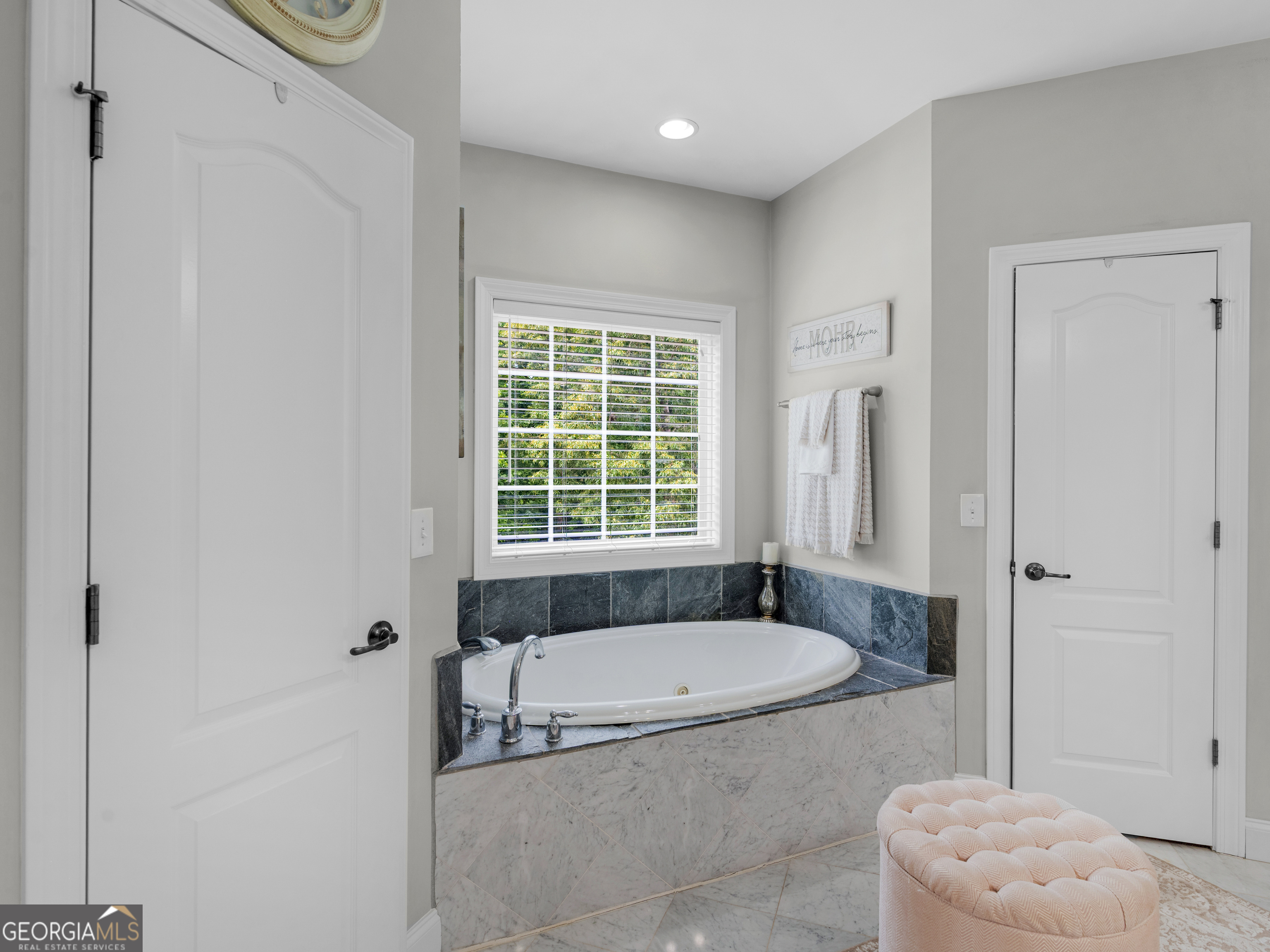 221 Hummingbird Court Hampton, GA 30228 - Photo 44 of 77 a bathroom with a granite countertop bathtub and a shower
