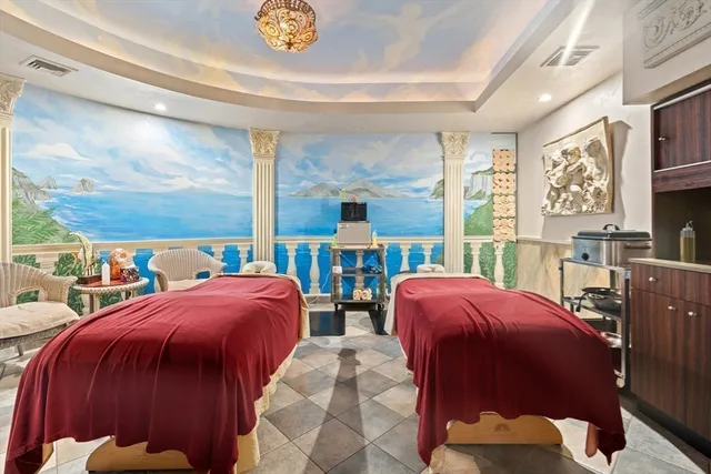 a view of a hallway with wooden floor and windows