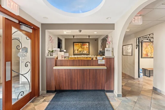 a front view of a house with garden