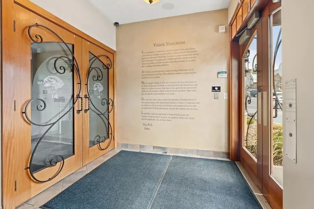 a lobby with furniture and floor to ceiling window