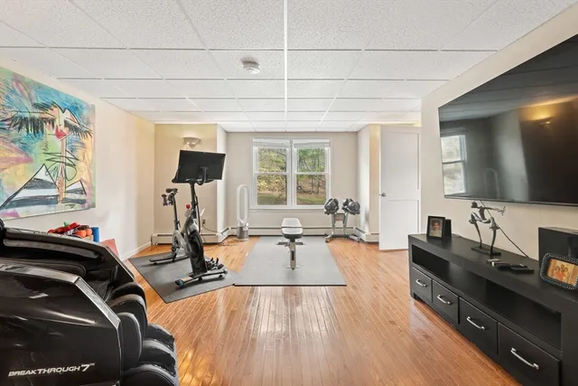 a room with gym equipment and a large window