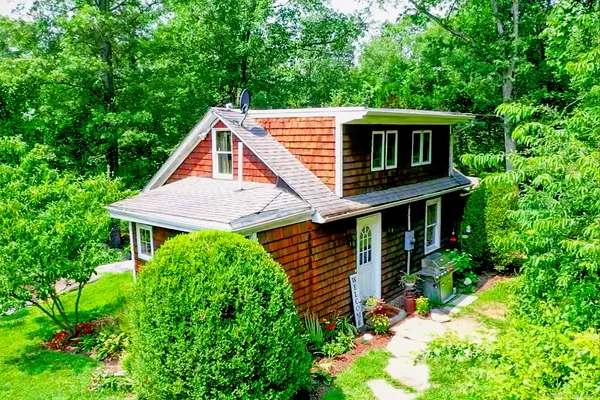 a aerial view of a house with a yard