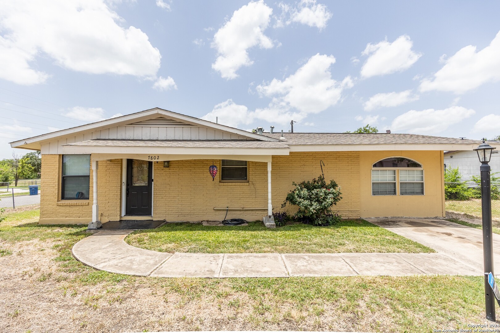 7802 Rimfire Drive San Antonio, TX 78227 - Photo 1 of 39 a front view of a house with a garden