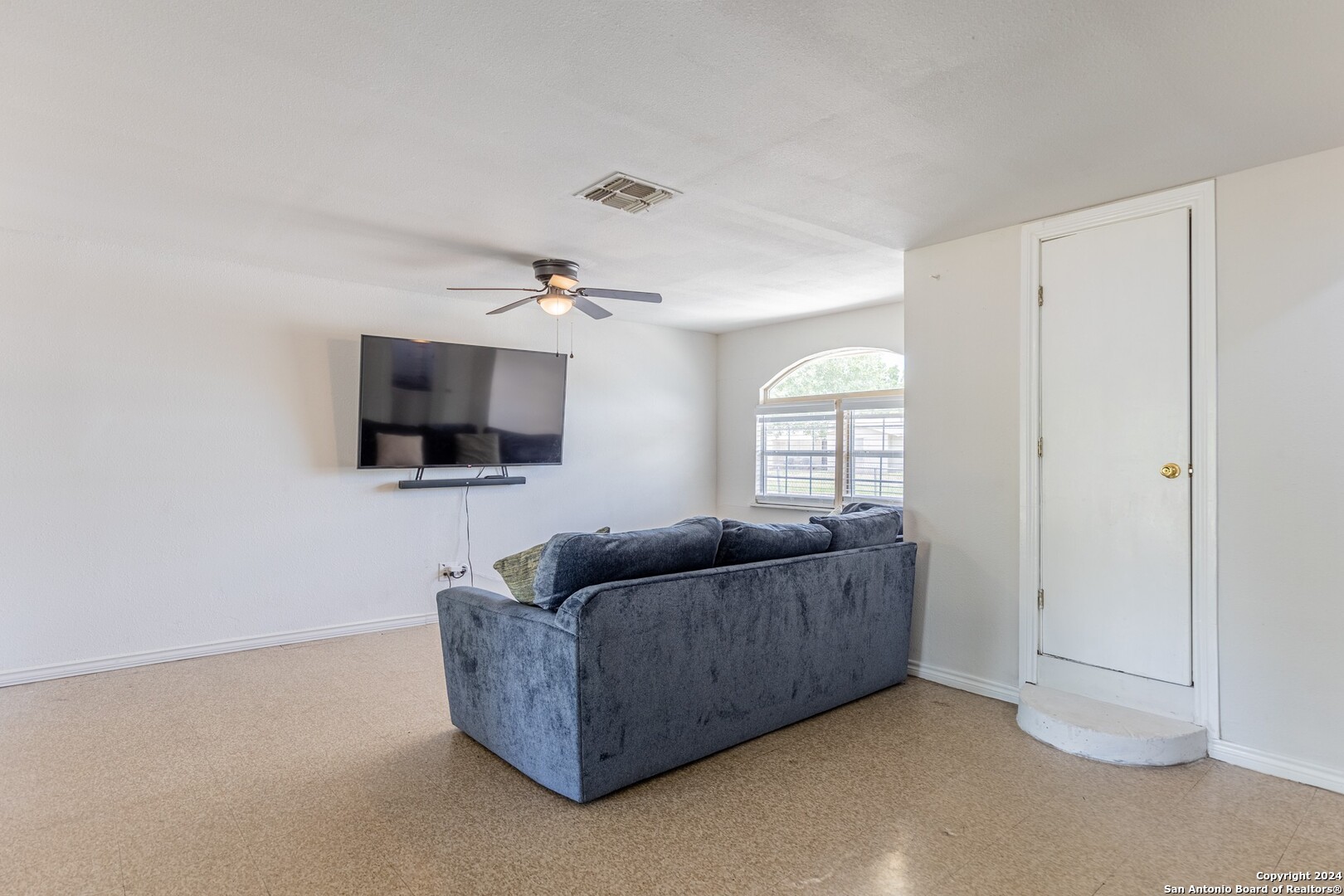 7802 Rimfire Drive San Antonio, TX 78227 - Photo 17 of 39 a living room with furniture and a flat screen tv