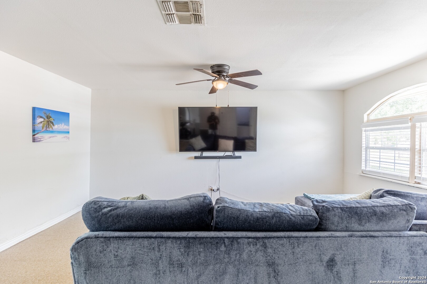 7802 Rimfire Drive San Antonio, TX 78227 - Photo 20 of 39 a living room with furniture and a flat screen tv
