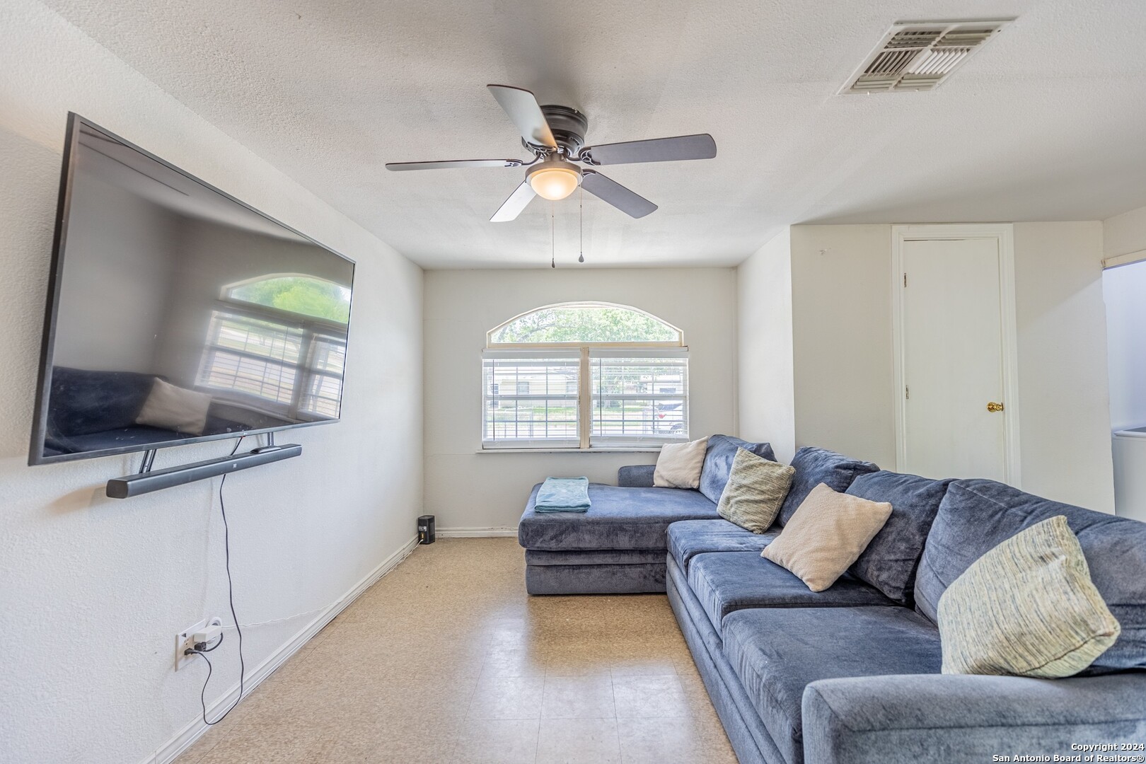 7802 Rimfire Drive San Antonio, TX 78227 - Photo 21 of 39 a living room with furniture and a large window