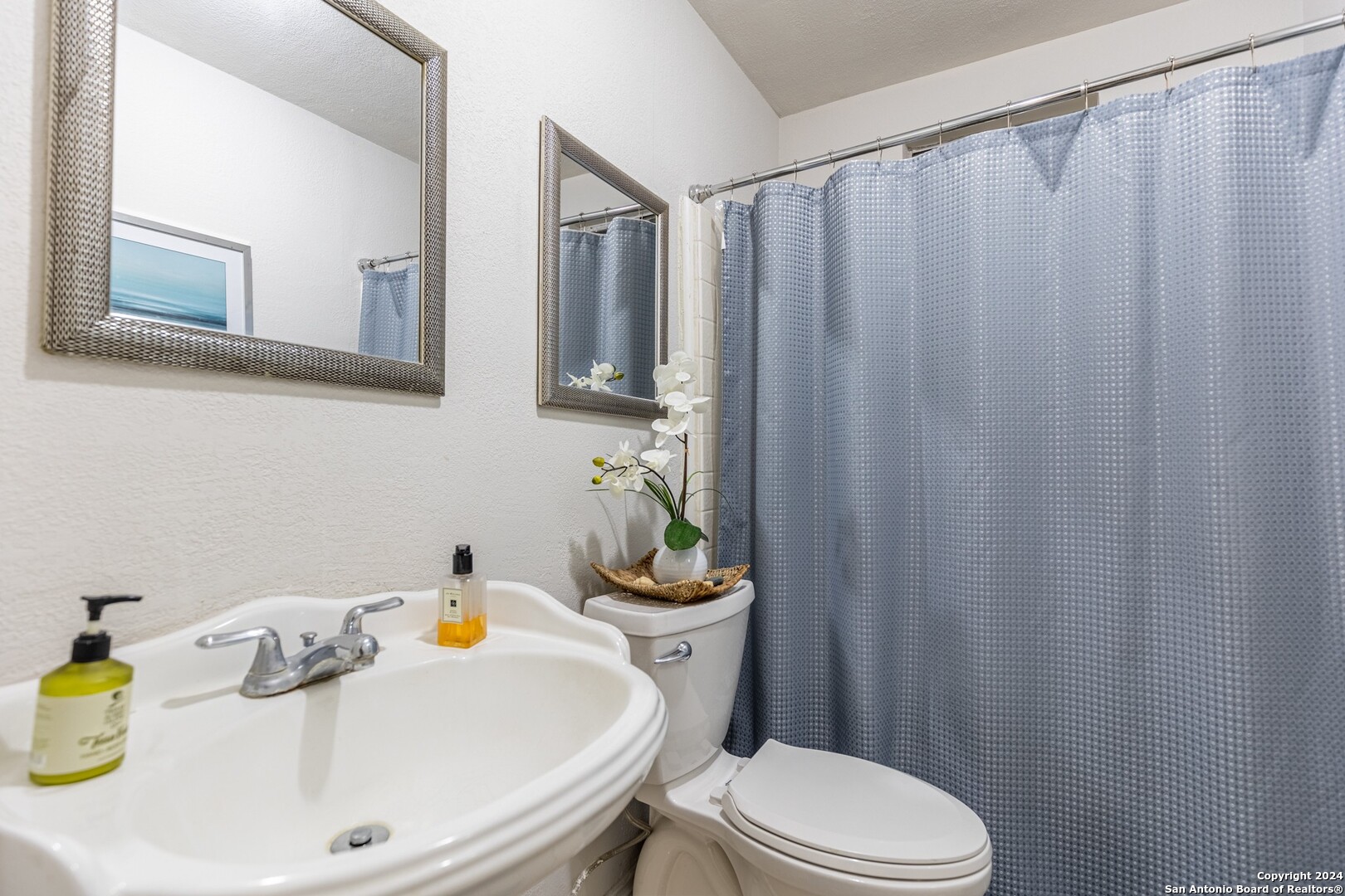 7802 Rimfire Drive San Antonio, TX 78227 - Photo 25 of 39 a white toilet sitting next to a bathroom sink