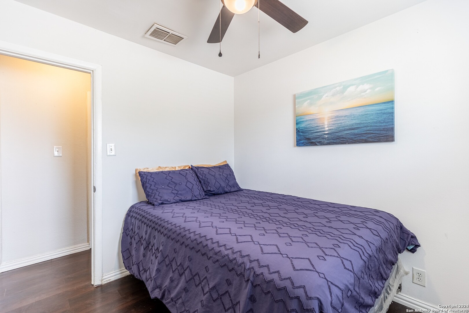 7802 Rimfire Drive San Antonio, TX 78227 - Photo 27 of 39 a large bed sitting in a bedroom next to a window