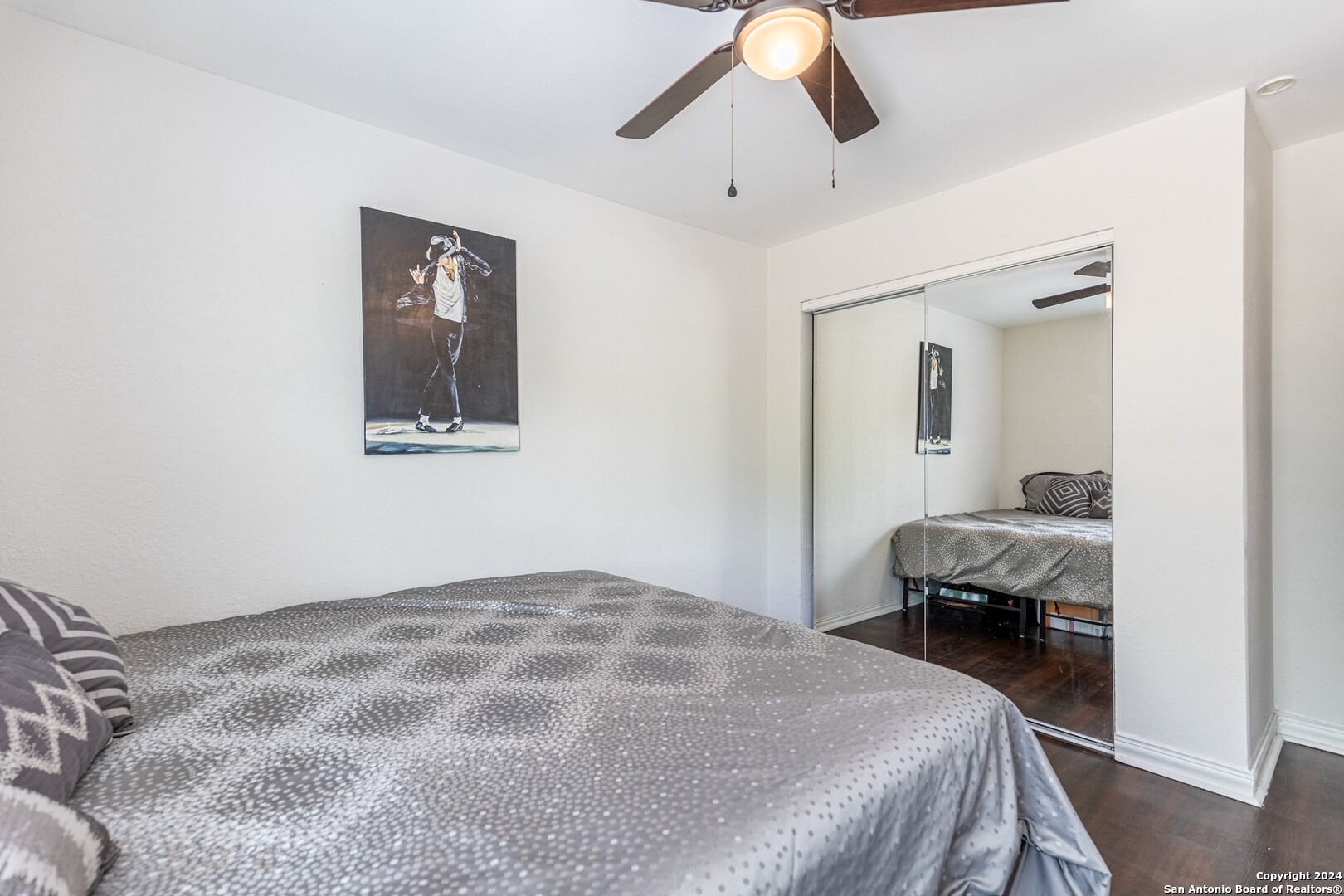 7802 Rimfire Drive San Antonio, TX 78227 - Photo 34 of 39 a bedroom with a bed and a chandelier