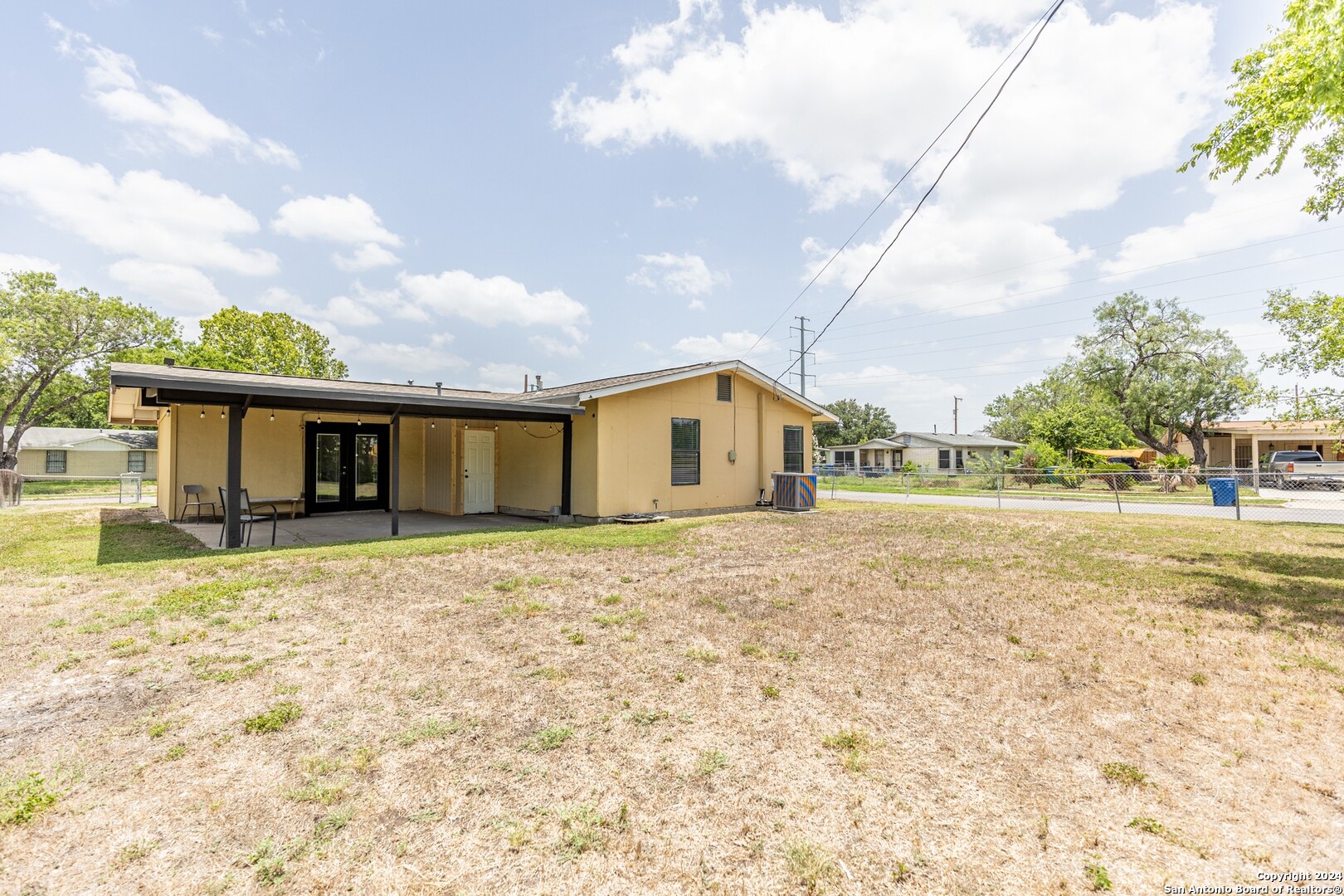 7802 Rimfire Drive San Antonio, TX 78227 - Photo 37 of 39 a front view of a house with a yard and garage