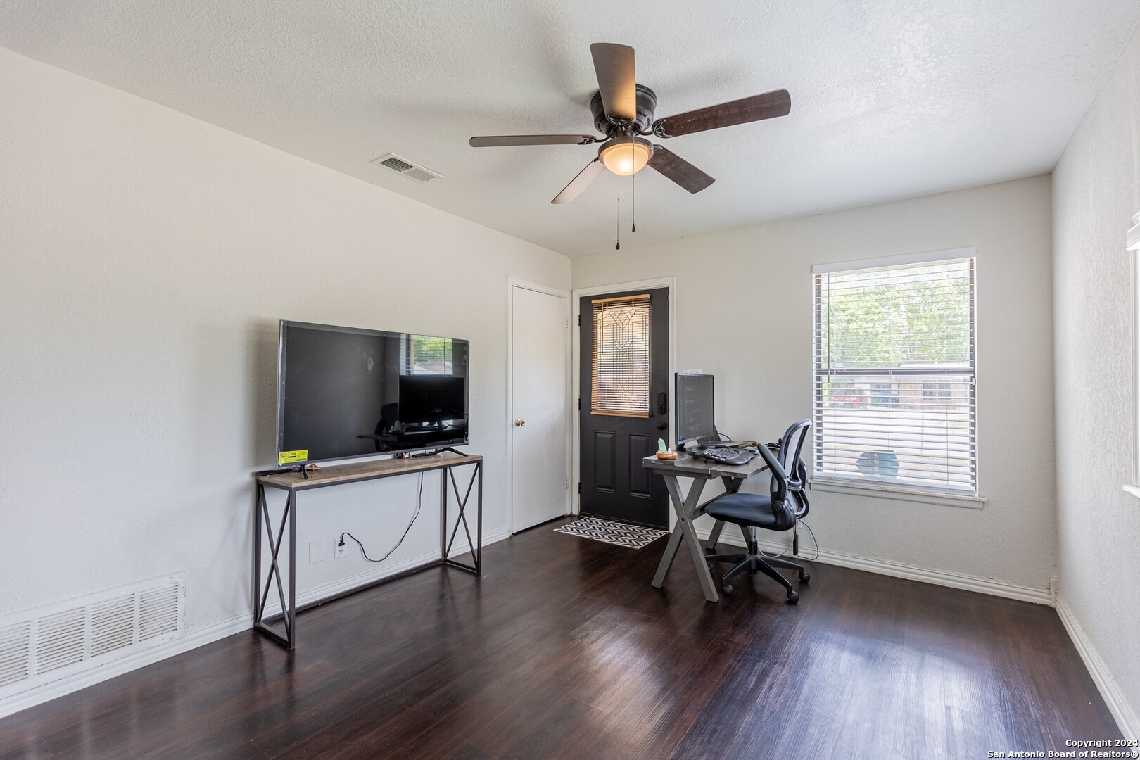 7802 Rimfire Drive San Antonio, TX 78227 - Photo 6 of 39 a living room with furniture and a flat screen tv