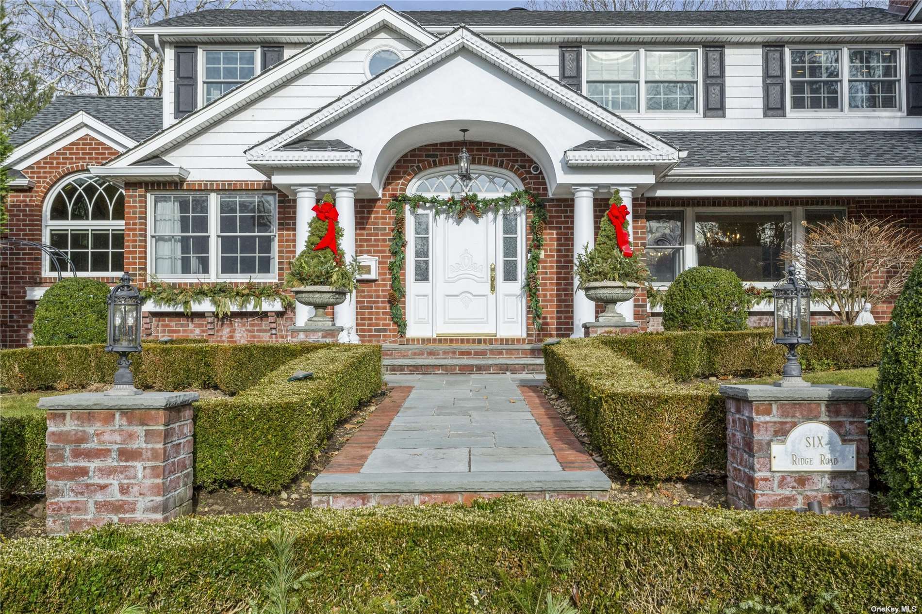 6 Ridge Road Searingtown, NY 11507 - Photo 1 of 1 a front view of a house with a garden