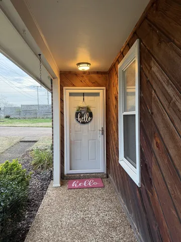 a front view of a house with a glass door