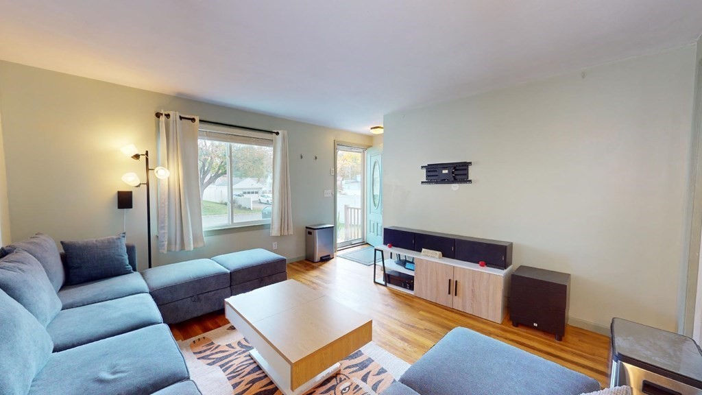 274 Cooper Street Springfield, MA 01108 - Photo 11 of 42 a living room with furniture and a window