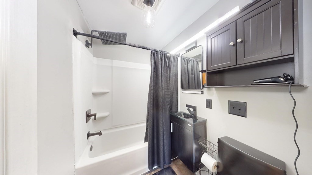 274 Cooper Street Springfield, MA 01108 - Photo 13 of 42 a bathroom with a tub shower vanity and a sink