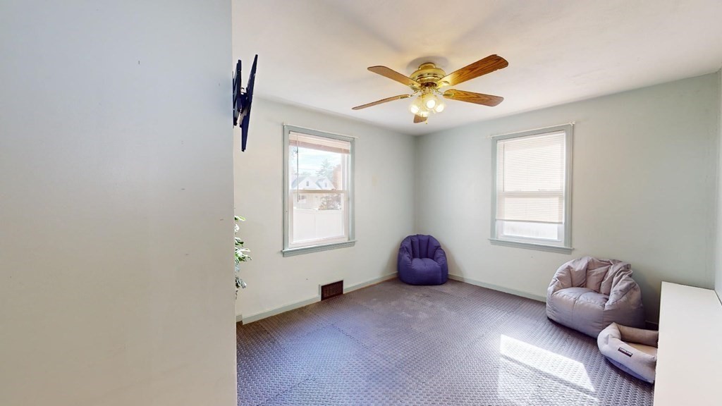 274 Cooper Street Springfield, MA 01108 - Photo 14 of 42 a bedroom with a bed and a window