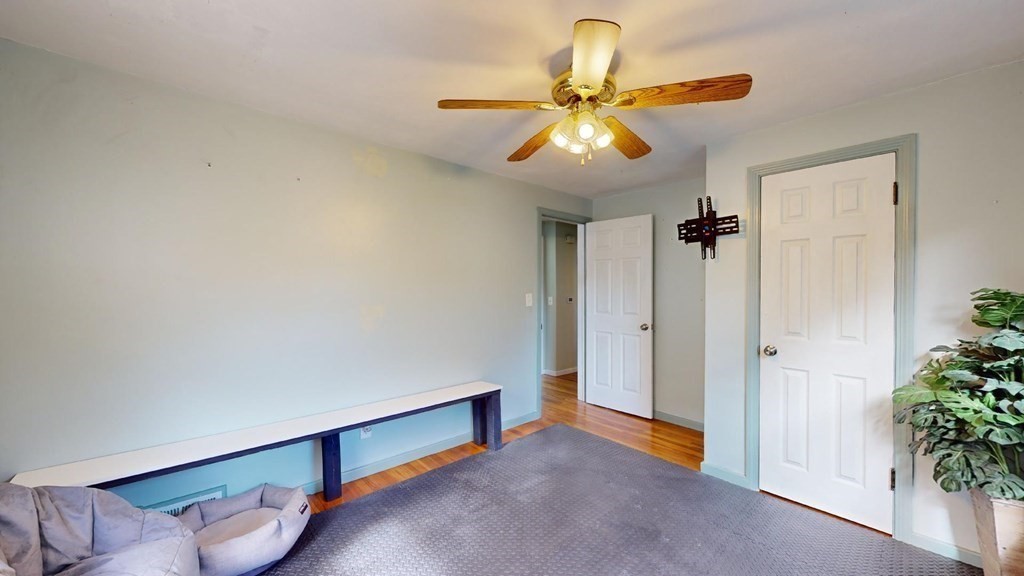 274 Cooper Street Springfield, MA 01108 - Photo 16 of 42 a view of room with window and wooden floor
