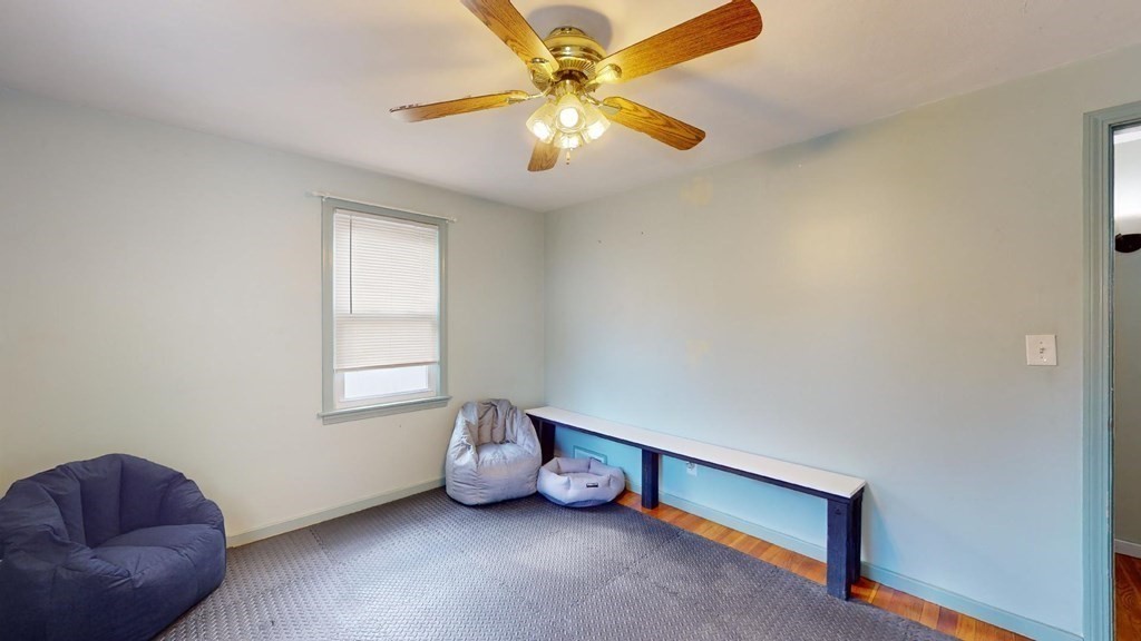274 Cooper Street Springfield, MA 01108 - Photo 17 of 42 a room with furniture and a window