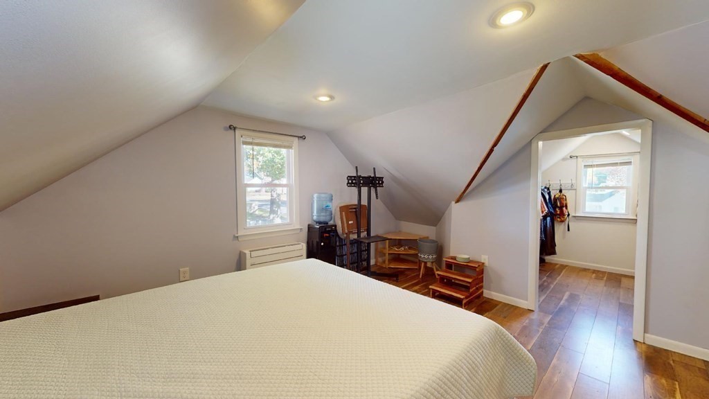 274 Cooper Street Springfield, MA 01108 - Photo 23 of 42 a bedroom with a bed and wooden floor