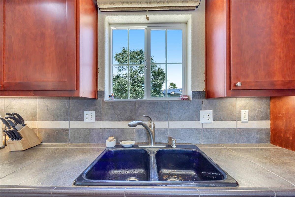 411 Sunrise Road Copperopolis, CA 95228 - Photo 26 of 76 Peek at your large backyard concrete patio area, perfect for adding an above ground pool or tinkering around in the large storage shed!