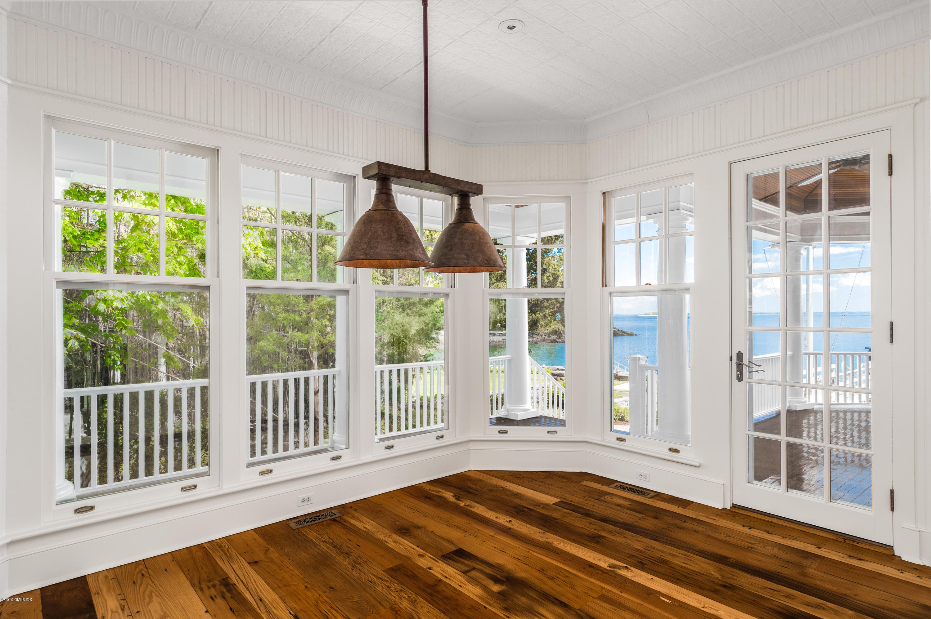 35 Byram Shore Road Greenwich, CT 06830 - Photo 14 of 32 a bedroom with furniture and windows