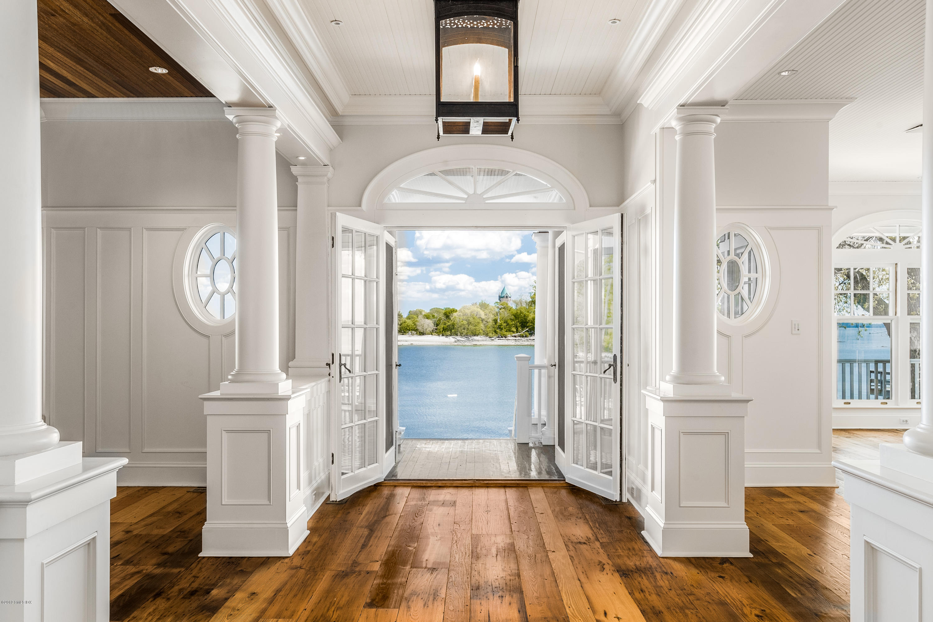 35 Byram Shore Road Greenwich, CT 06830 - Photo 15 of 32 a view of a hallway view with wooden floor and staircase