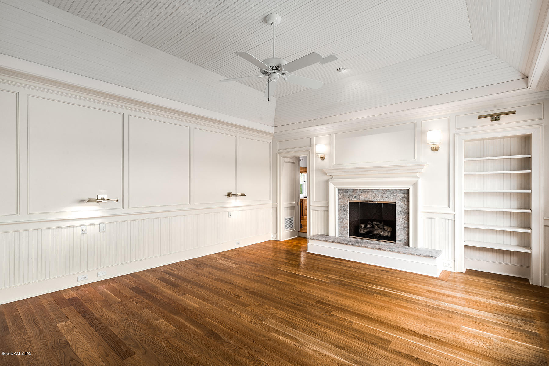35 Byram Shore Road Greenwich, CT 06830 - Photo 18 of 32 a view of an empty room with a fireplace and a window