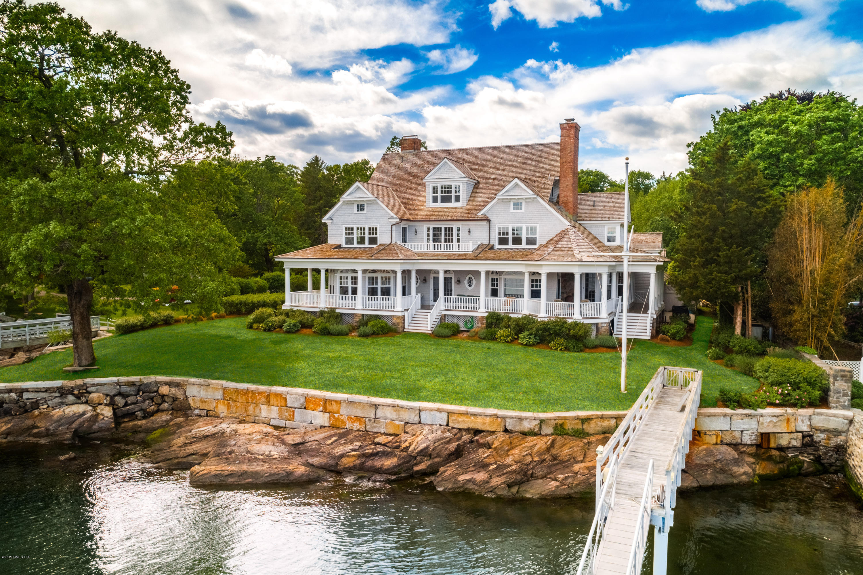 35 Byram Shore Road Greenwich, CT 06830 - Photo 25 of 32 a view of a house with a yard from a lake view