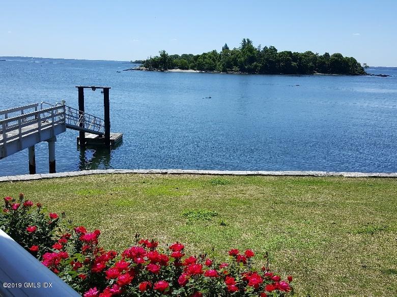 35 Byram Shore Road Greenwich, CT 06830 - Photo 28 of 32 a view of a lake and a garden