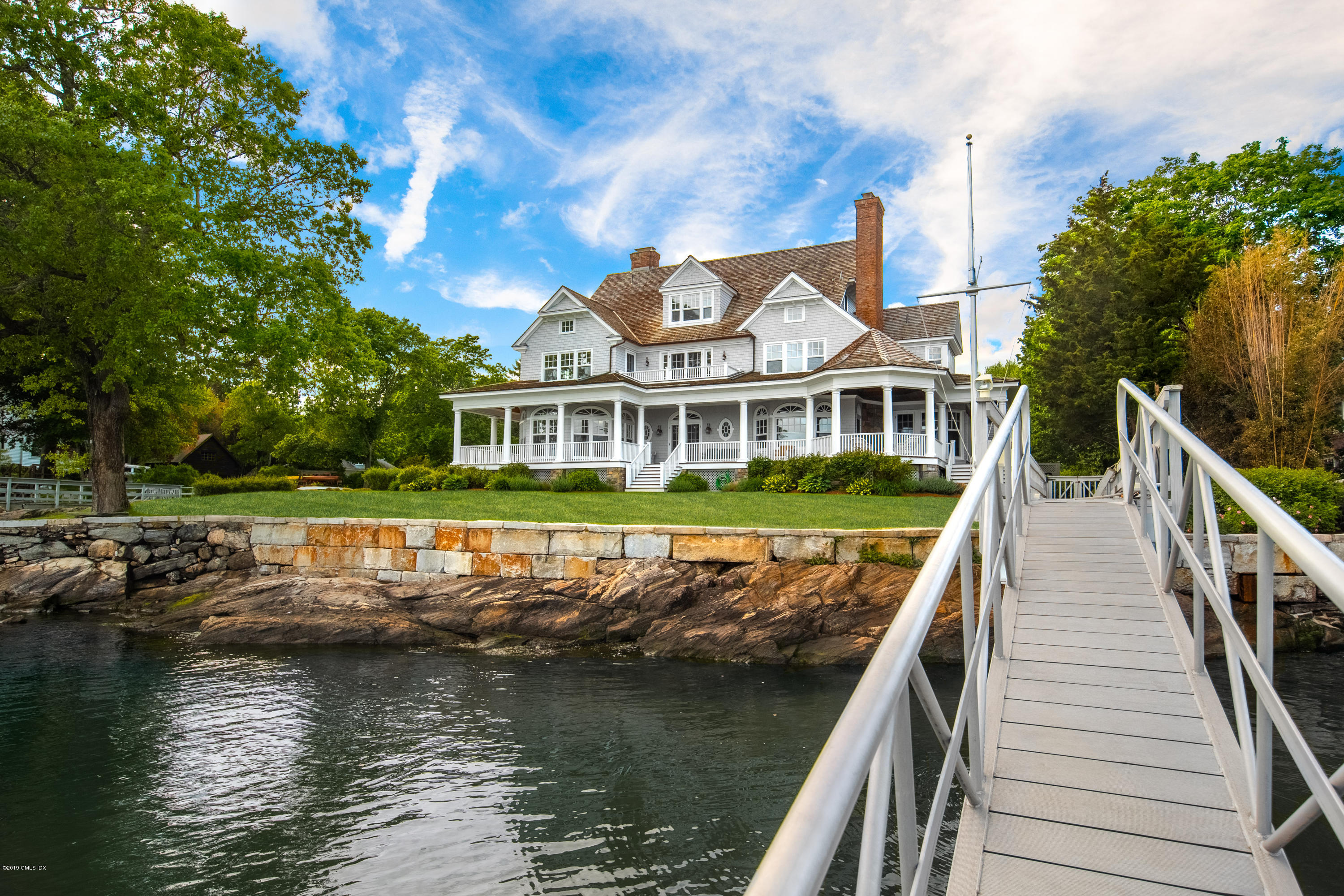 35 Byram Shore Road Greenwich, CT 06830 - Photo 3 of 32 a view of residential houses with yard and large trees