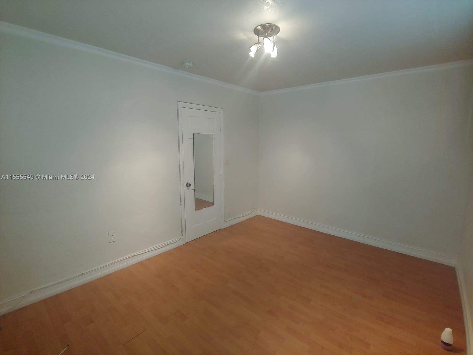 7928 Harding Avenue, Unit 8 Miami Beach, FL 33141 - Photo 16 of 30 an empty room with a empty space
