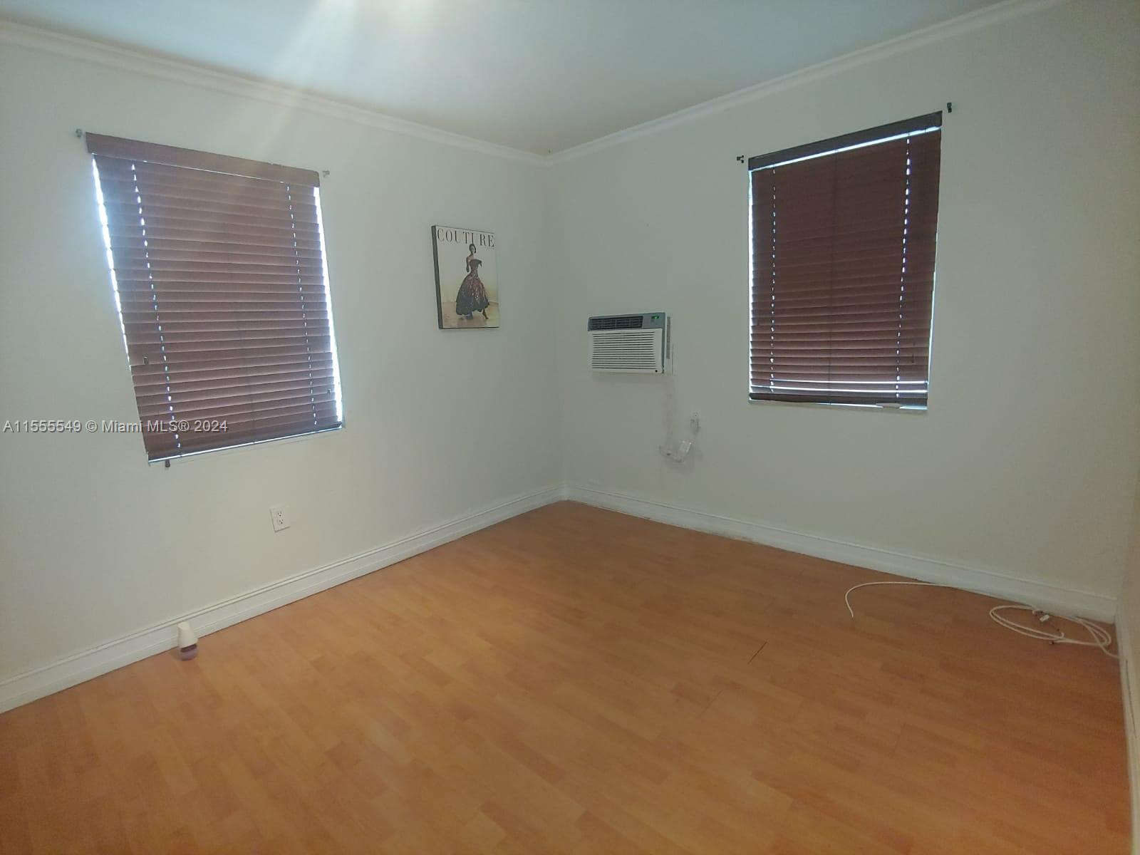 7928 Harding Avenue, Unit 8 Miami Beach, FL 33141 - Photo 21 of 30 a view of an empty room with a window
