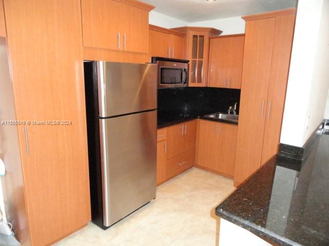 7928 Harding Avenue, Unit 8 Miami Beach, FL 33141 - Photo 23 of 30 a view of a kitchen with a refrigerator