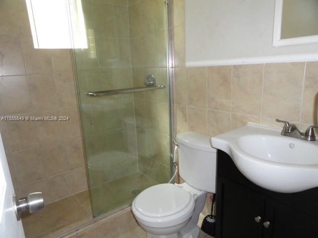 7928 Harding Avenue, Unit 8 Miami Beach, FL 33141 - Photo 26 of 30 a bathroom with a sink toilet and shower