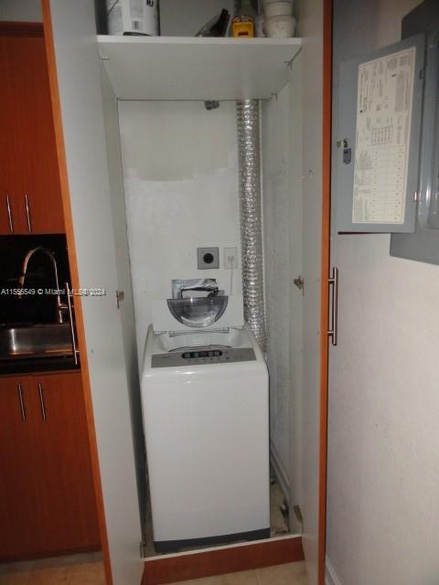 7928 Harding Avenue, Unit 8 Miami Beach, FL 33141 - Photo 10 of 30 a storage room with washer and dryer