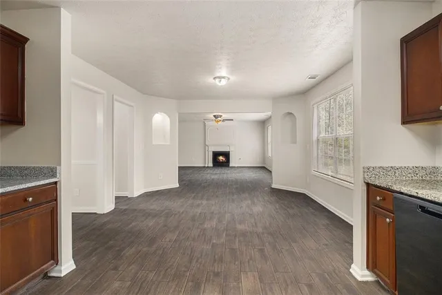 a view of a kitchen cabinets and wooden floor