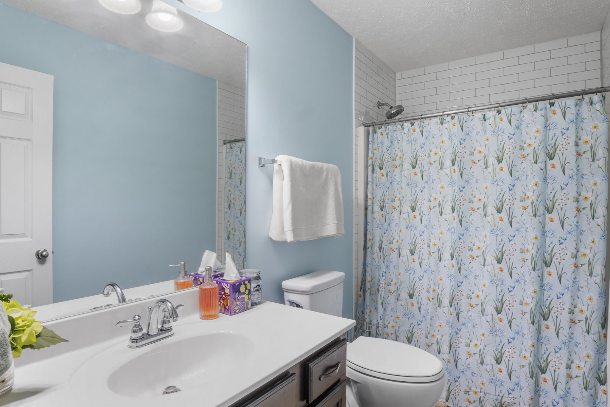 3306 Barretts Ridge Drive Murfreesboro, TN 37130 - Photo 18 of 24 a bathroom with a sink a toilet and shower curtain