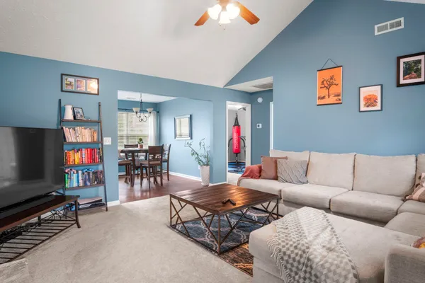 a living room with furniture and a flat screen tv
