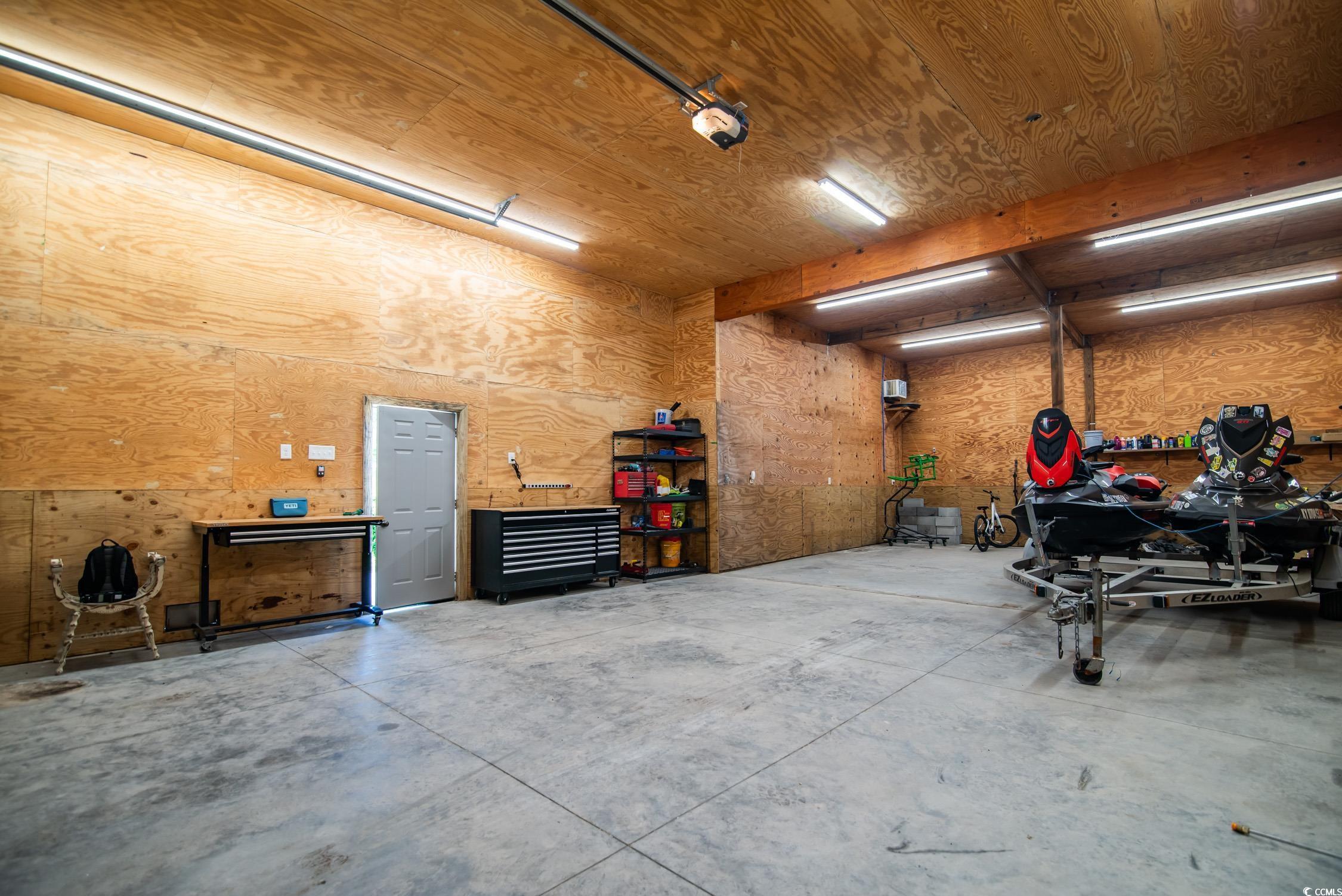 127 Brown Pelican Loop Pawleys Island, SC 29585 - Photo 17 of 31 Garage with a workshop area