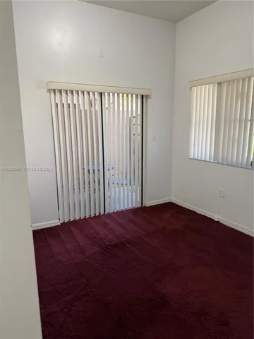 wooden floor in a hall with a window