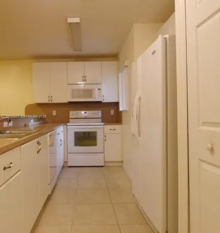 a kitchen with stainless steel appliances a stove and a refrigerator