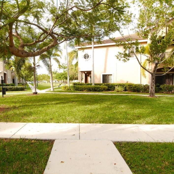 22911 Southwest 88th Place, Unit 521 Cutler Bay, FL 33190 - Photo 6 of 11 a view of building with outdoor space