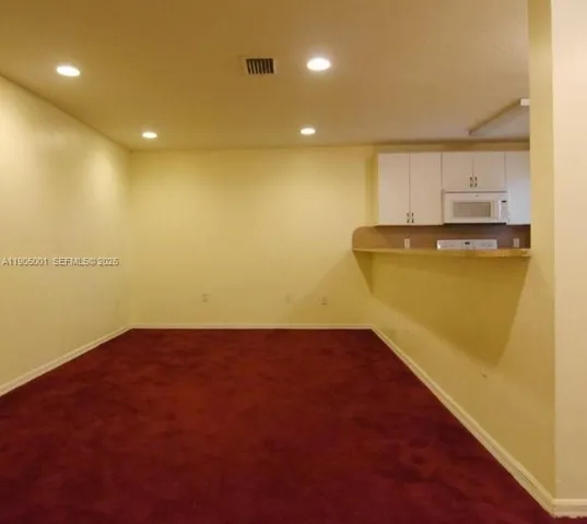 a view of storage and utility room with a sink