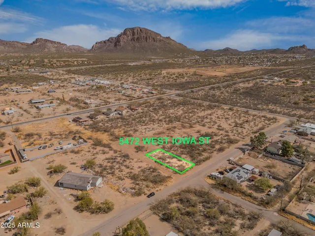 a view of a mountain with a mountain in the background
