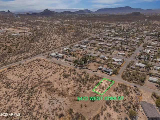 a view of a field with an ocean