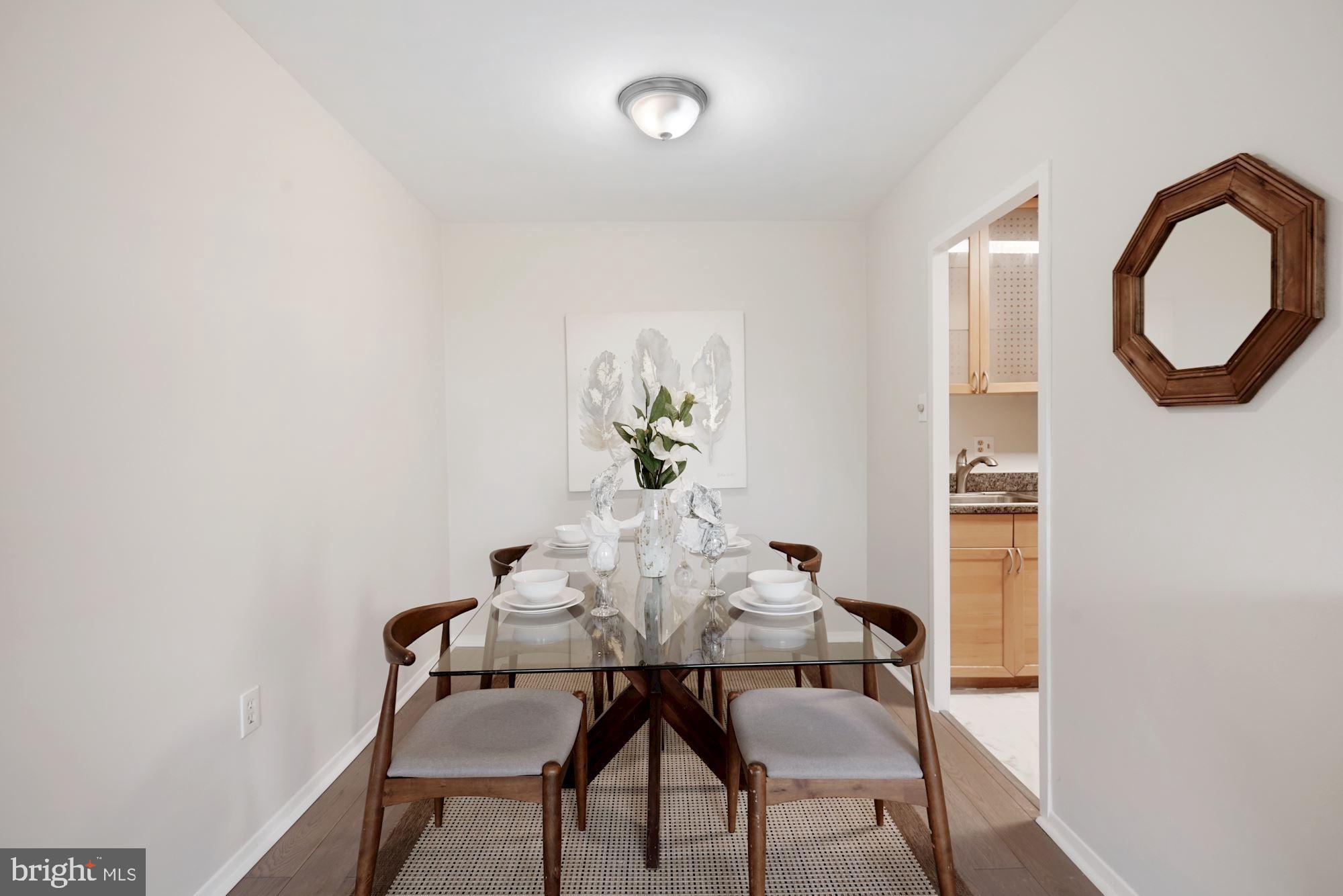4000 Tunlaw Road Northwest, Unit 1123 Washington, DC 20007 - Photo 12 of 31 a dining room with furniture and window