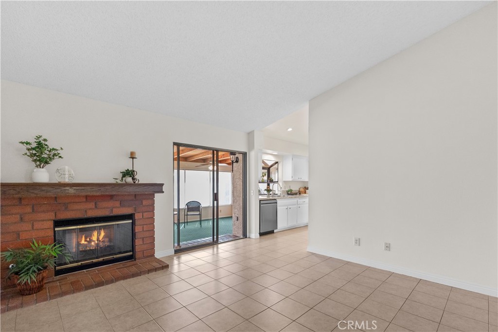 1157 West Orchard Street Rialto, CA 92376 - Photo 12 of 38 a living room with furniture and a fireplace