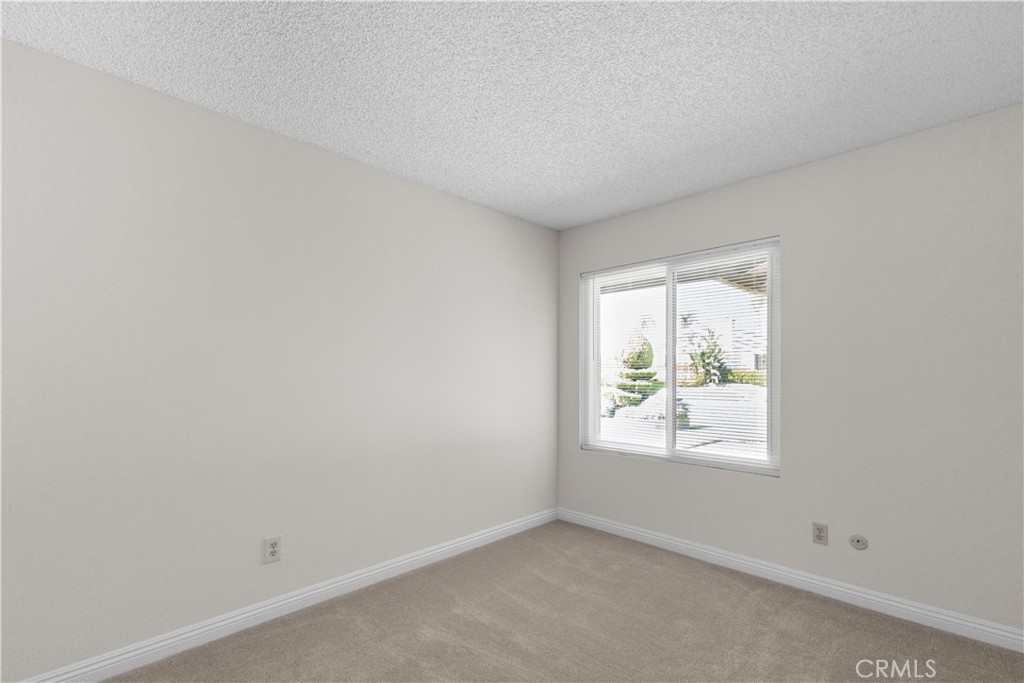 1157 West Orchard Street Rialto, CA 92376 - Photo 21 of 38 an empty room with windows