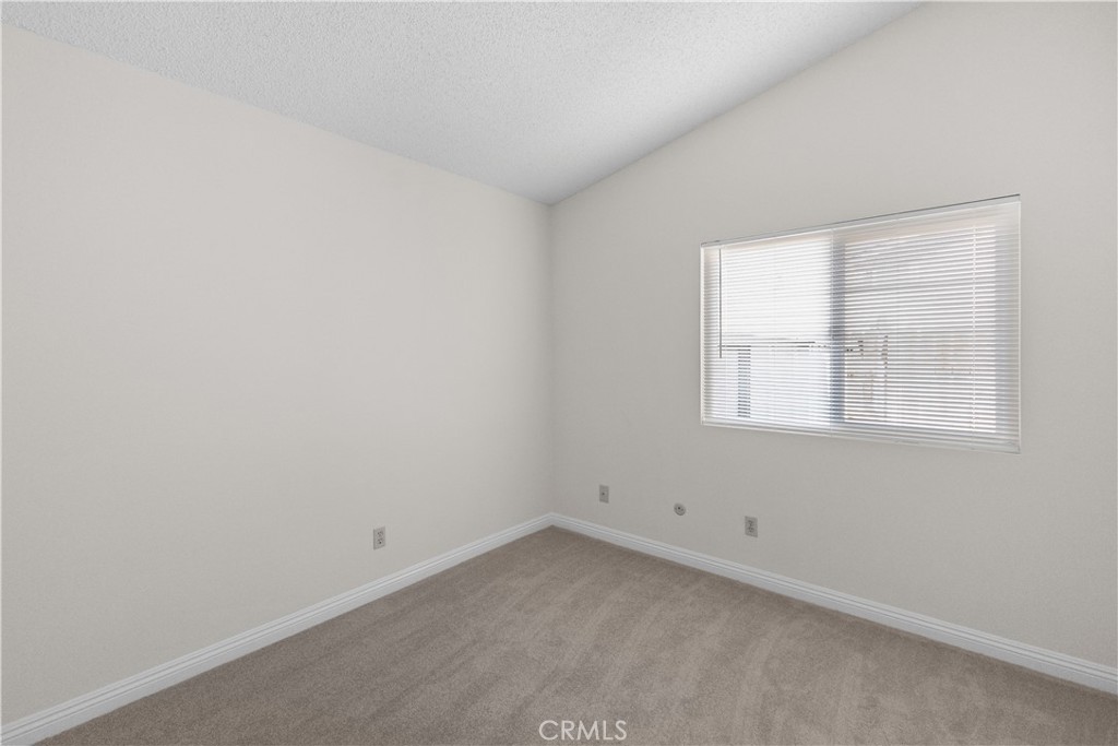 1157 West Orchard Street Rialto, CA 92376 - Photo 27 of 38 an empty room with a window